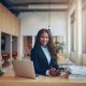 African businesswoman smiling at desk 299130290