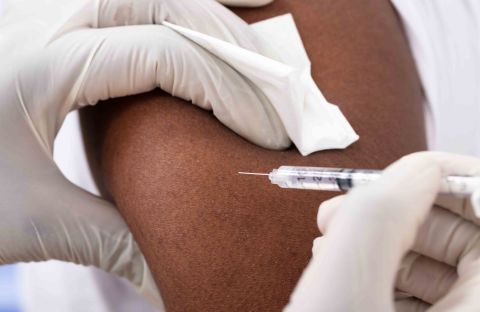 Close Up Person Getting A Vaccine Injection 244160917